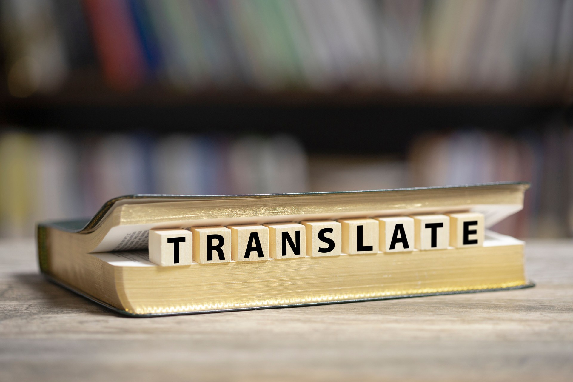 Book on desk with Translate word